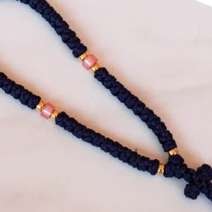 Detail of the knots and the beads of an all handmade traditional drk blue 50 knots brojanica